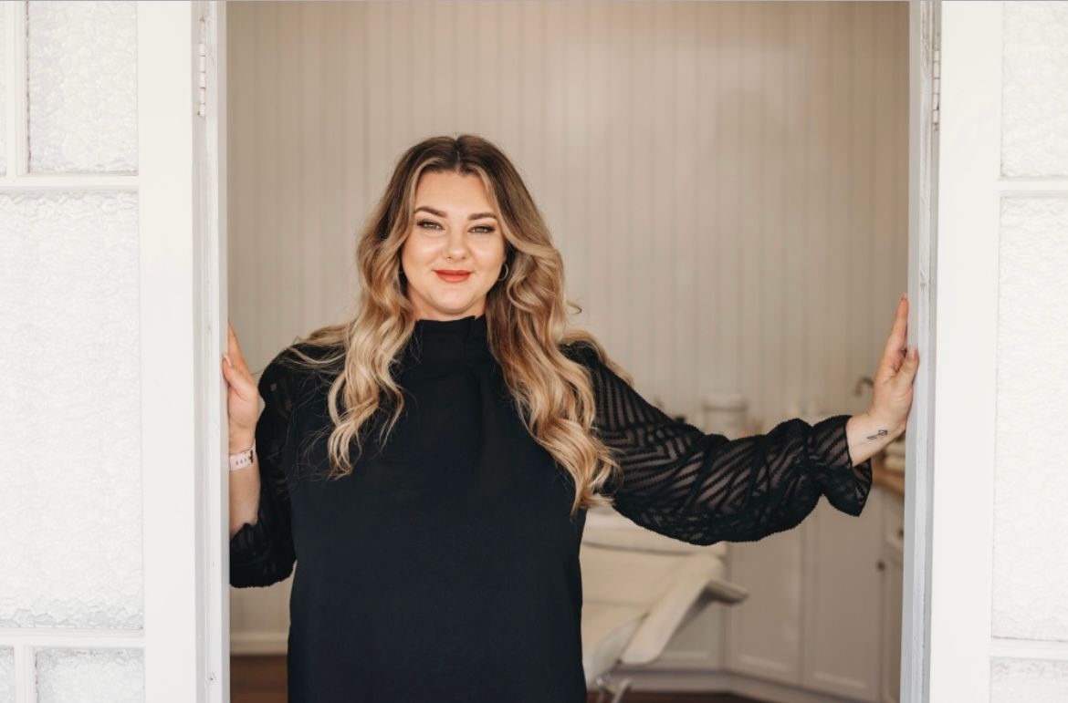 Lady standing in Doorway — Gladstone Beauty Clinic In Gladstone Central QLD