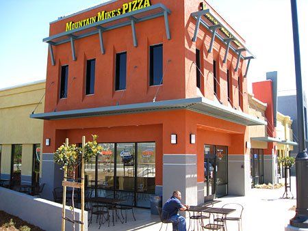 Glass Works — Orange Building with Glass Doors in Pleasanton, CA