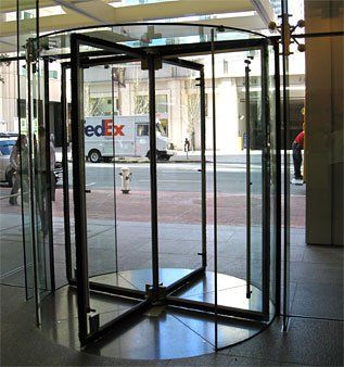 Glass Projects — Rotating Door with Metal Frame and Glass Body in Pleasanton, CA