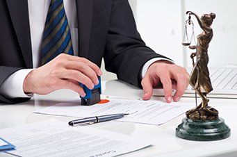 Lawyer signing contract - Criminal Law Attorney in Tarboro, NC
