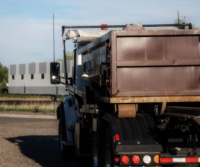 Construction Roll-Off truck on a job site
