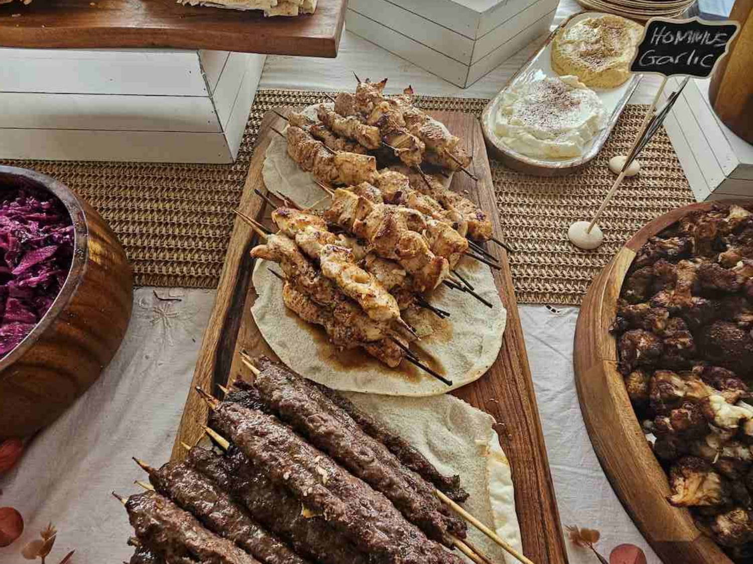 A Buffet Spread with Skewers of Meat, Hummus — The Habibiz Catering in Taree, NSW