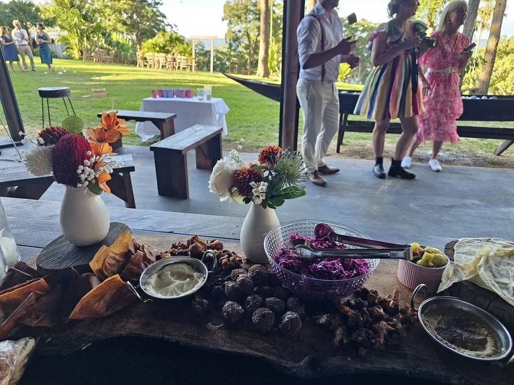 A Catered Outdoor Event with Food Platters and People Socializing — The Habibiz Catering in Taree, NSW