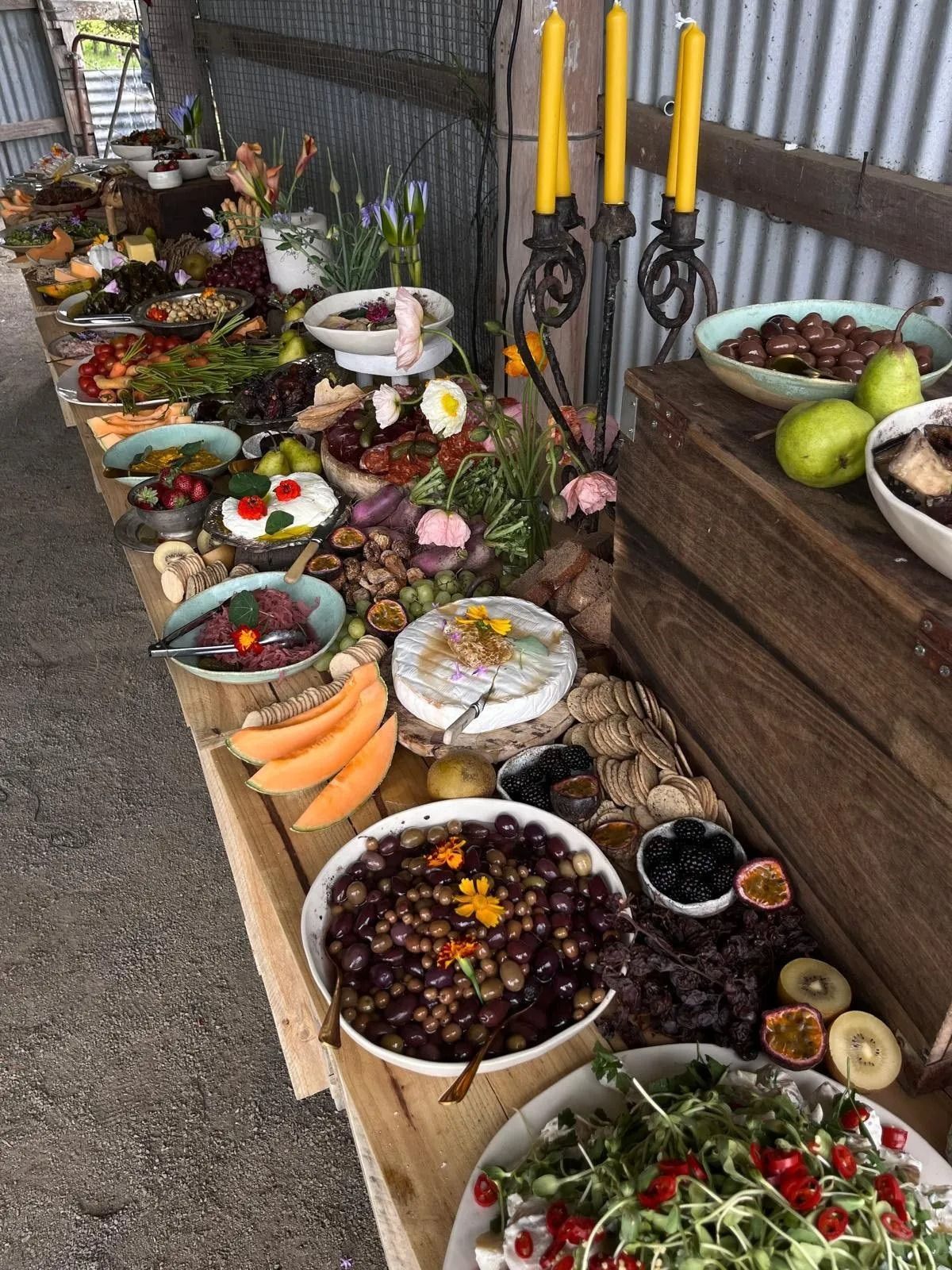 Charcuterie Board on a Rustic Wooden Table With Various Fruits — The Habibiz Catering In Wingham, NSW