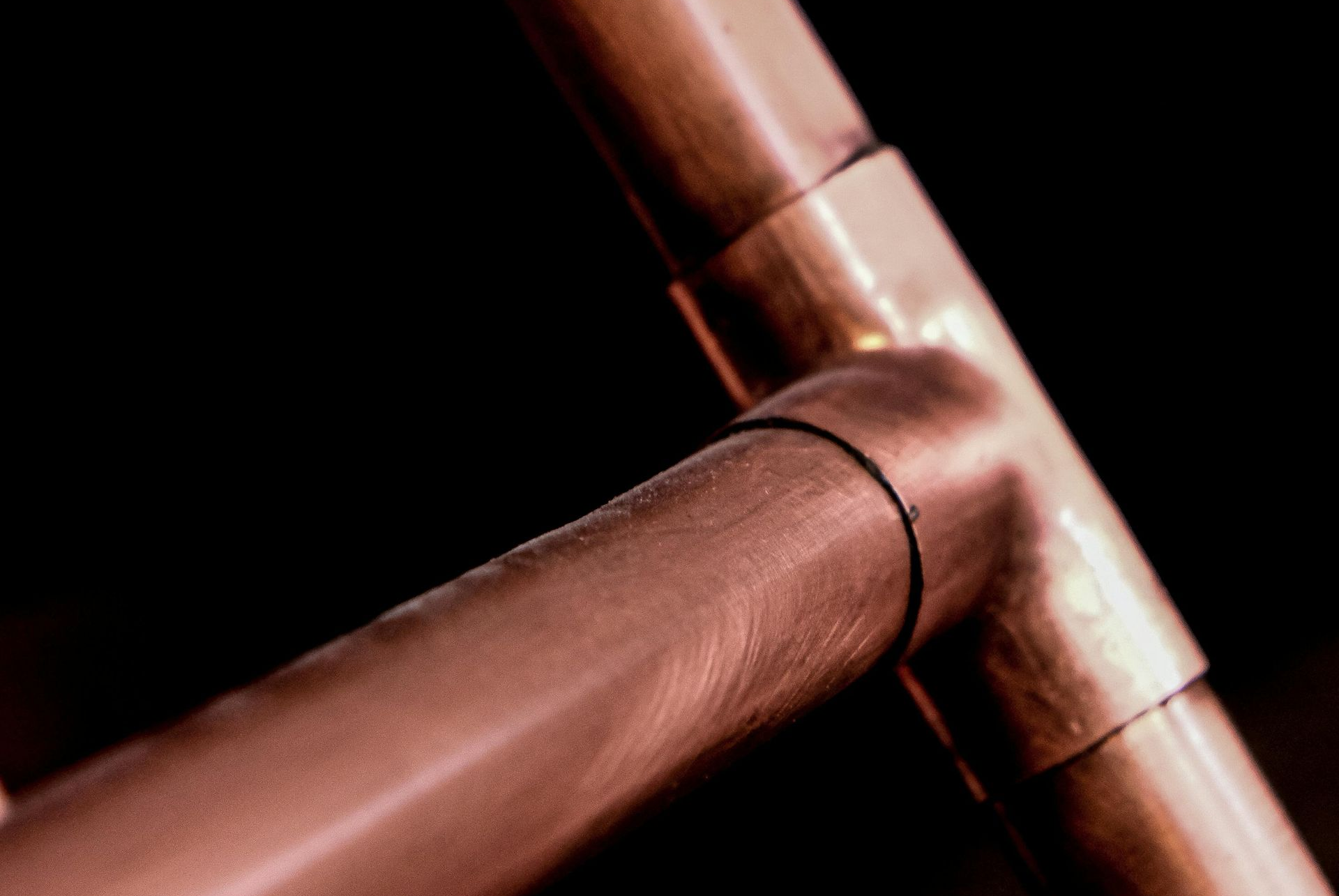 Copper pipes and fittings joined together.