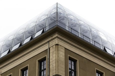 the corner of a building with a glass roof