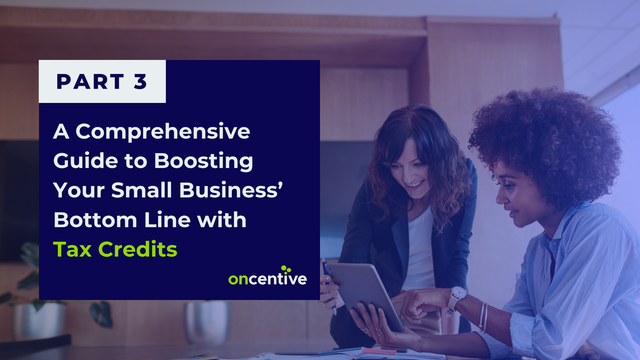 Employees looking at guide with text: Boosting Your Bottom Line with Small Business Tax Credits