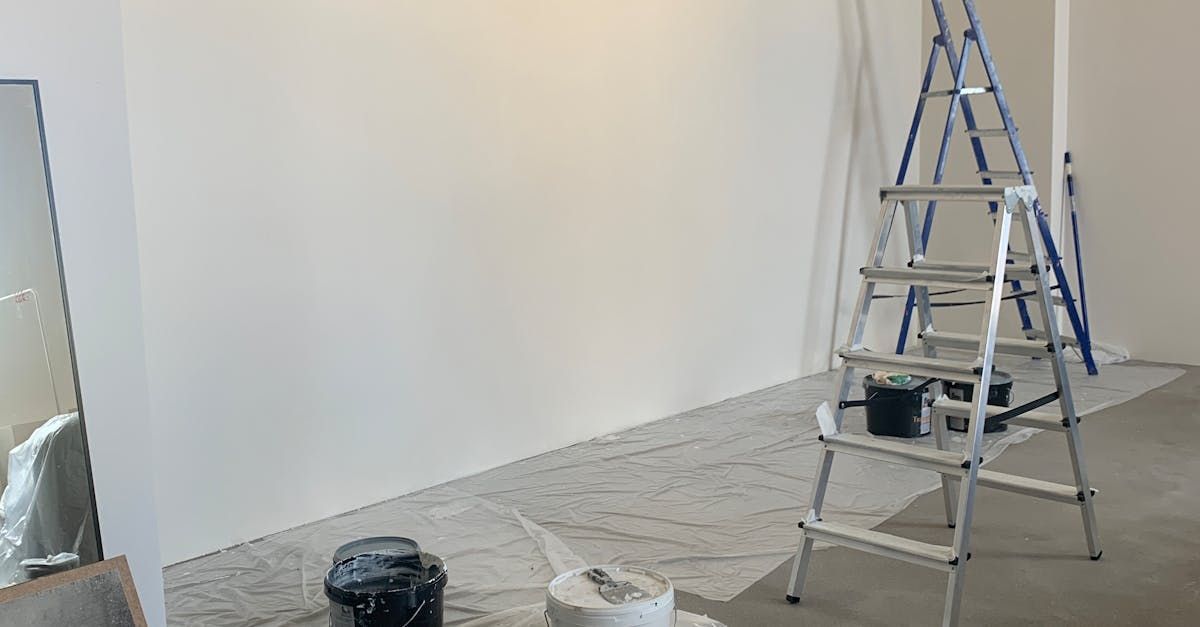 Painter painting and staining