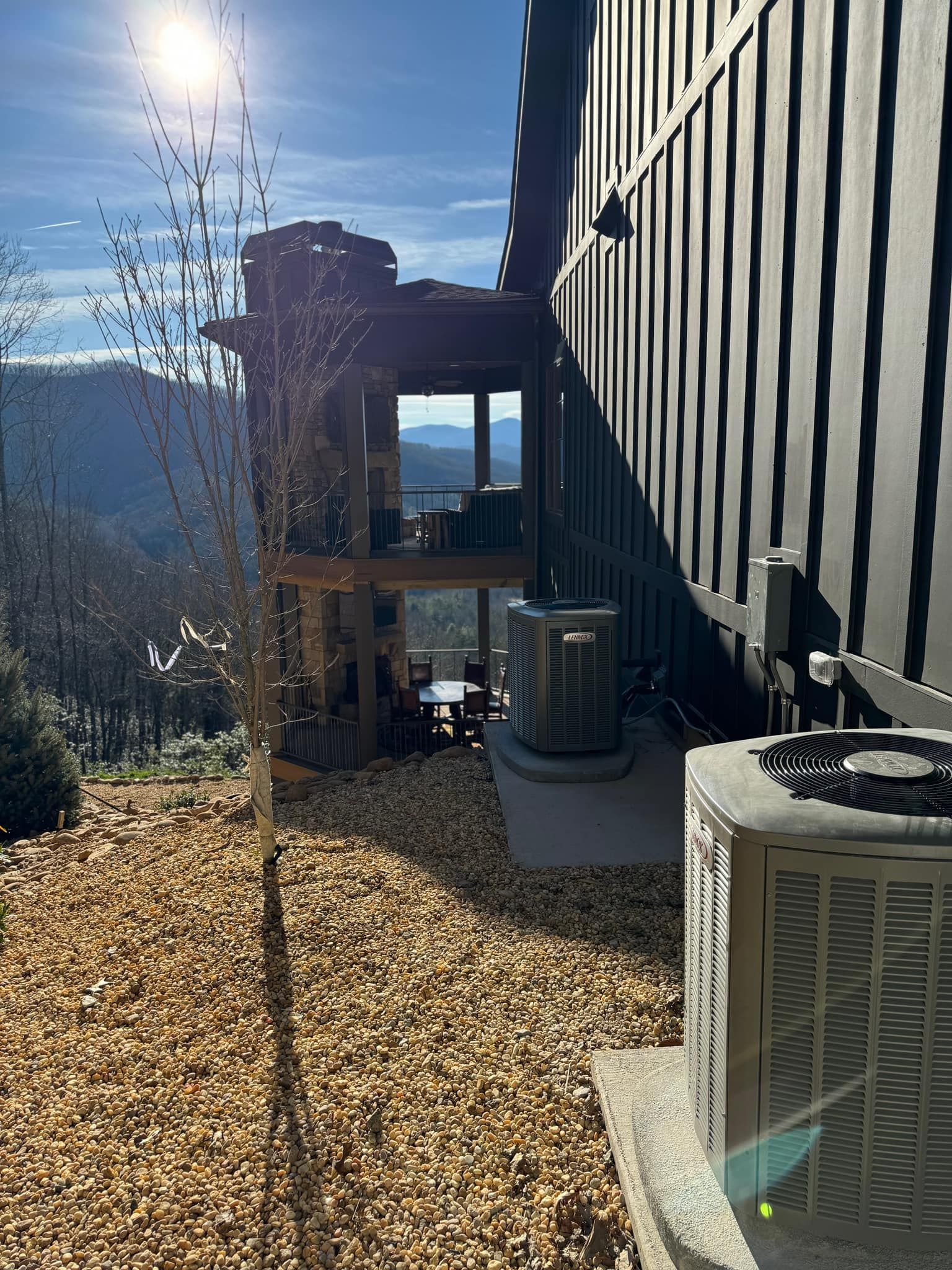 A house with a large air conditioner on the side of it.