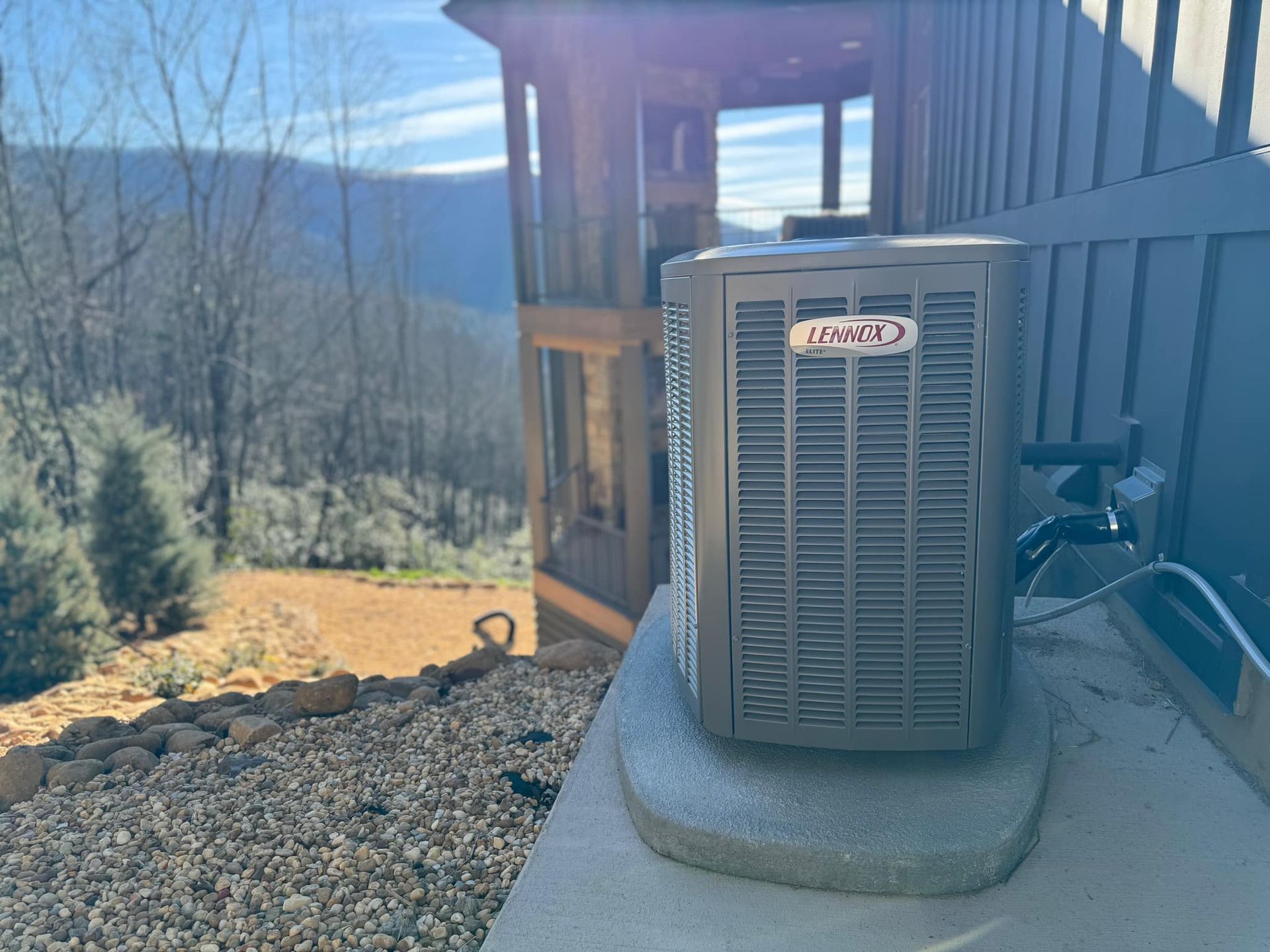 An air conditioner is sitting on the side of a building.