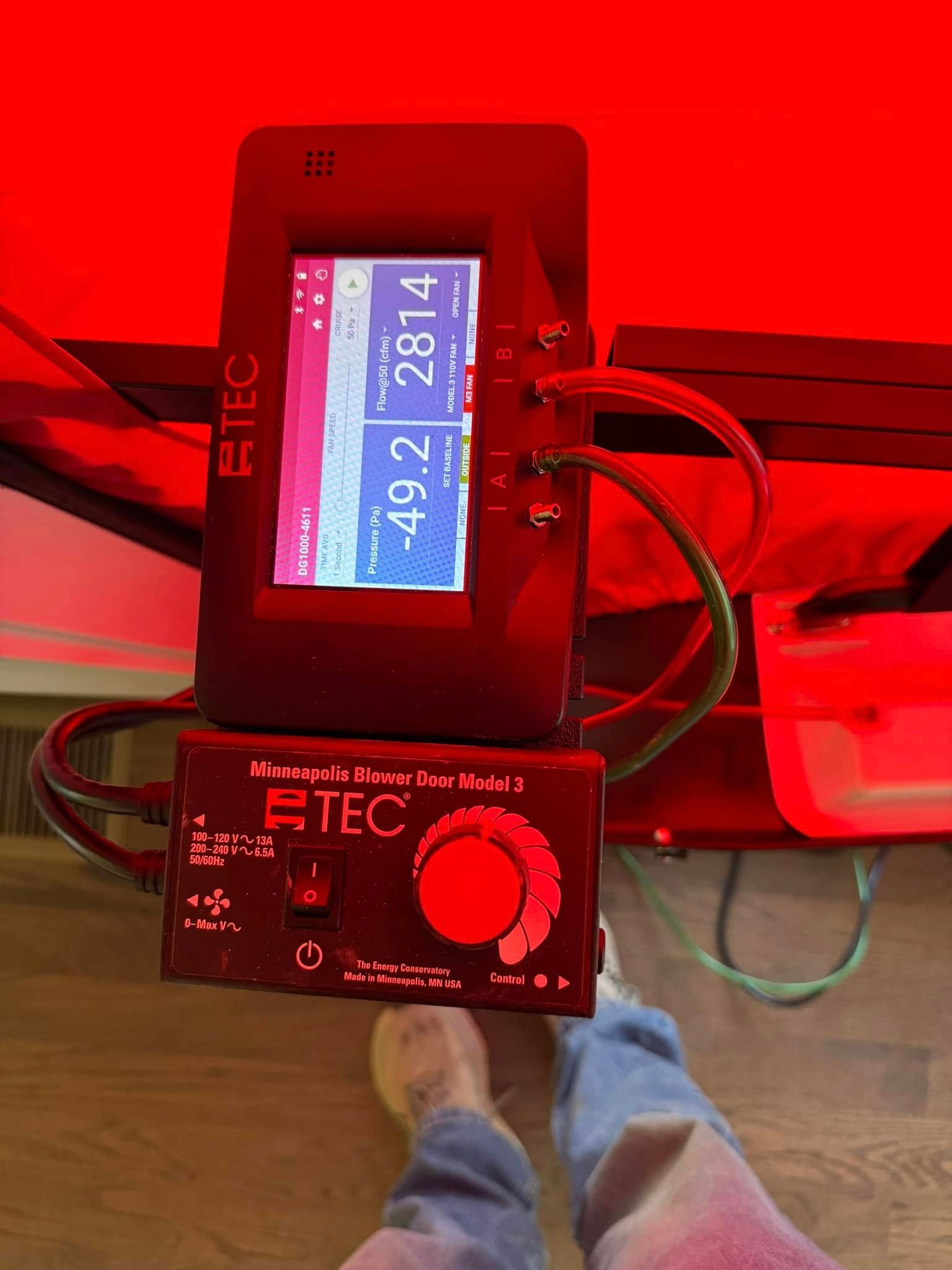 A person is standing next to a device that says rtec on it