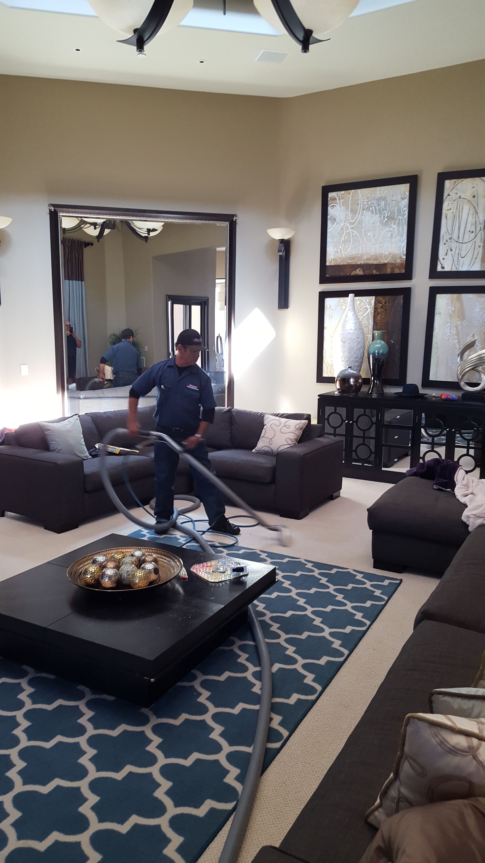A white fur rug is sitting on a wooden floor.
