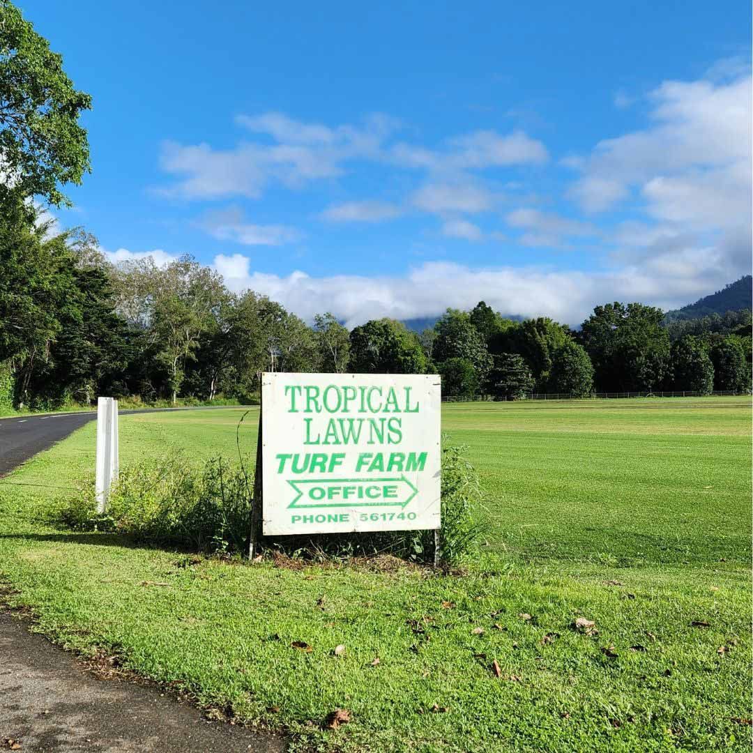 A Sign That Says Tropical Lawns Turf Farm On It — Tropical Lawns Pty Ltd In Little Mulgrave Qld