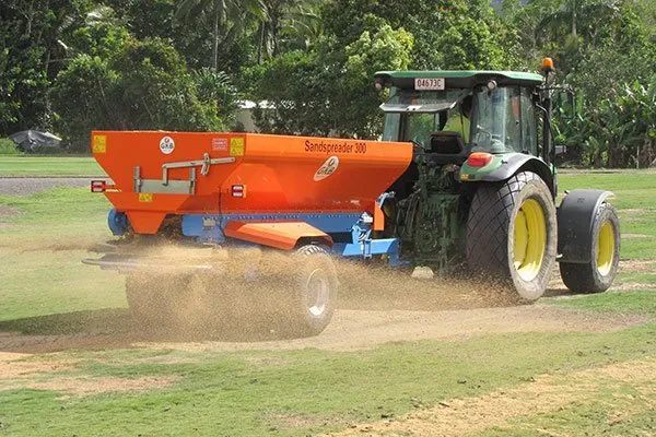 Sand Spreading On Grass — Tropical Lawns Pty Ltd In Little Mulgrave QLD