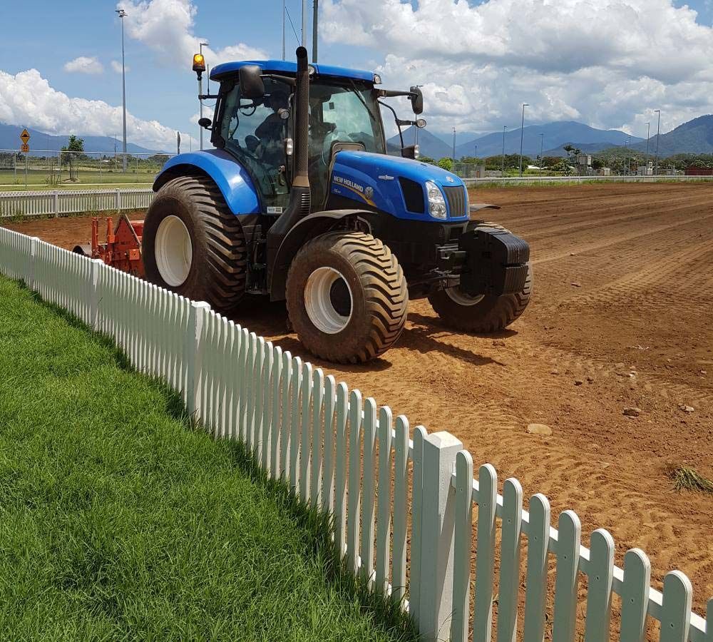 Tiny Type Of Grass With Tractor — Tropical Lawns Pty Ltd In Little Mulgrave QLD