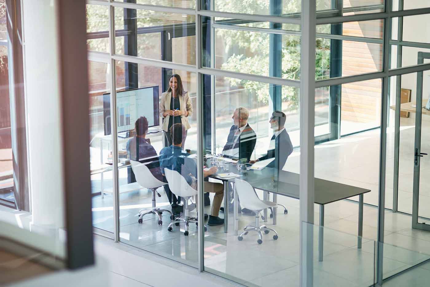 A group of people are having a meeting in a conference room.