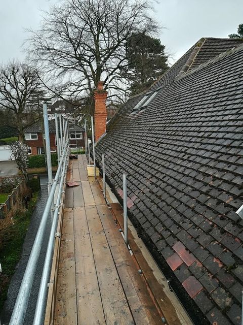 tile being laid on roof