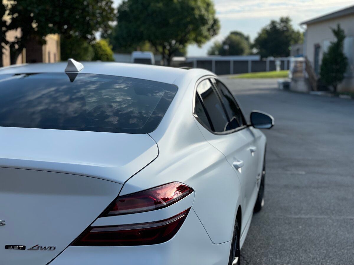 a white car with the word 4wd on the back