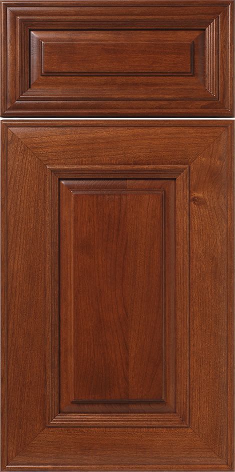 Two wooden cabinet doors with a raised panel design in a warm brown tone.