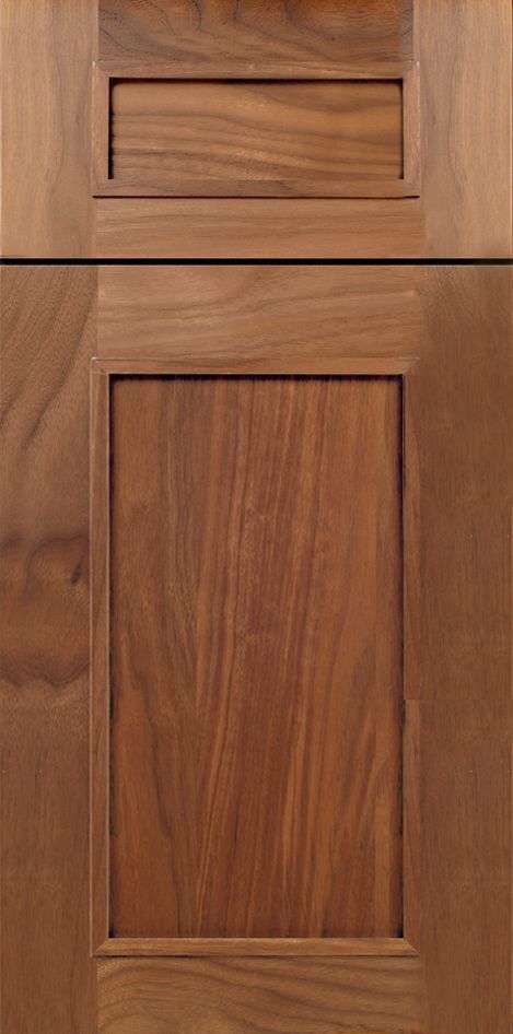 Wooden cabinet door with a recessed rectangular pull and a raised panel.