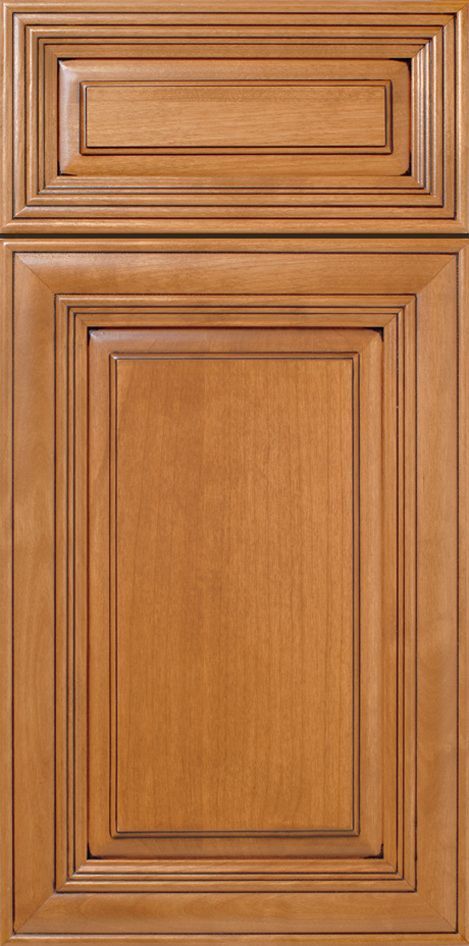 A wood kitchen cabinet door with a raised panel design and a medium-brown finish.
