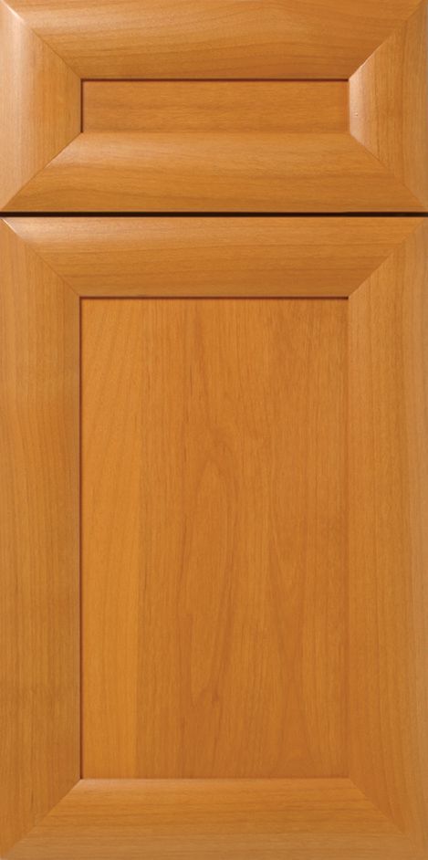 Wooden cabinet door with recessed panel. Light brown finish.