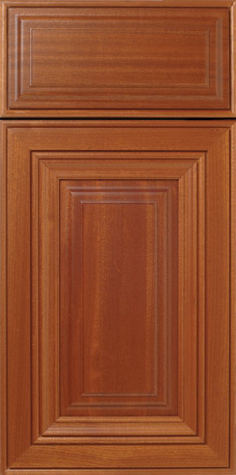Wooden cabinet door with a raised panel and decorative trim in a warm brown color.