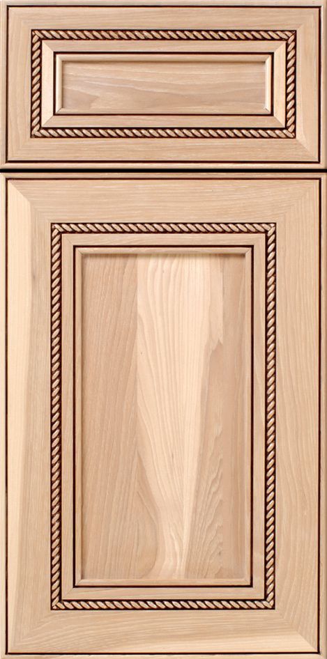 Wooden kitchen cabinet door with a raised panel and rope trim.