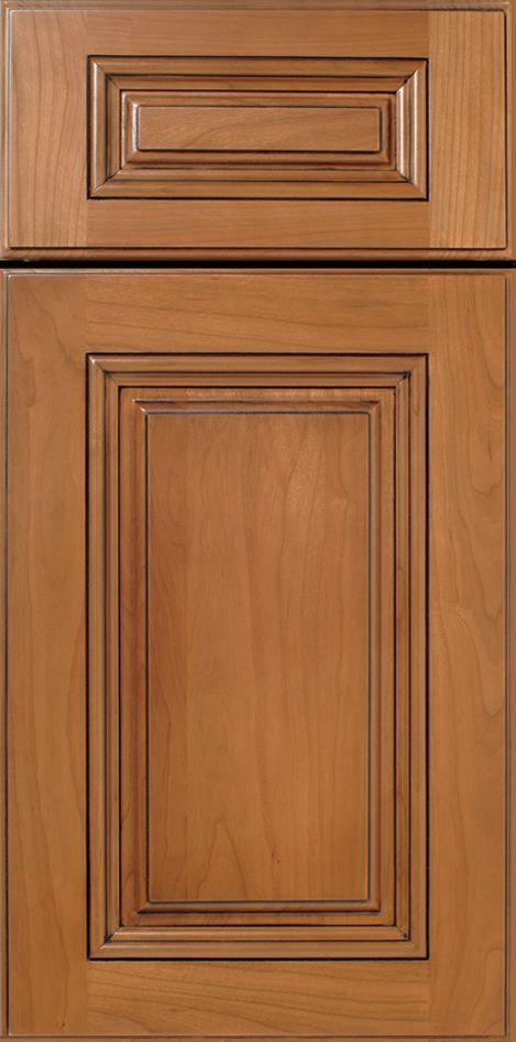 Wooden cabinet door with a light brown stain and inset panel.