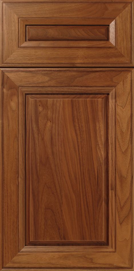Wooden cabinet door with raised panel and recessed top panel.
