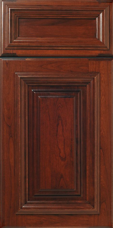 Dark cherry-stained raised-panel kitchen cabinet door with detailed frame and wood grain.