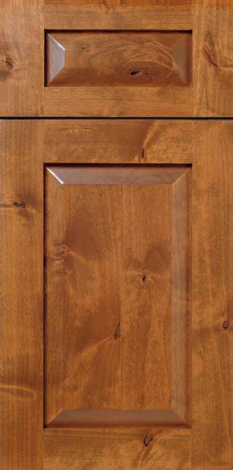 Wooden cabinet door with a raised, rectangular panel.