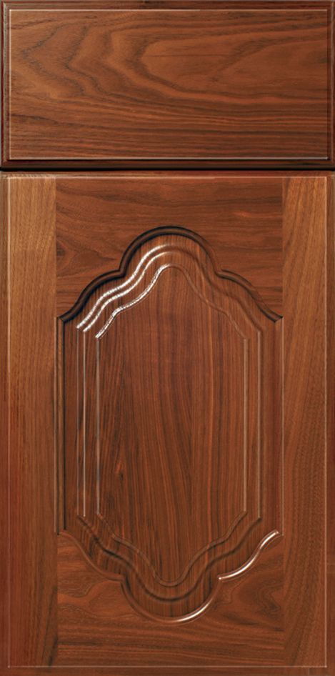 Wooden cabinet door with raised decorative panel. Dark brown finish.