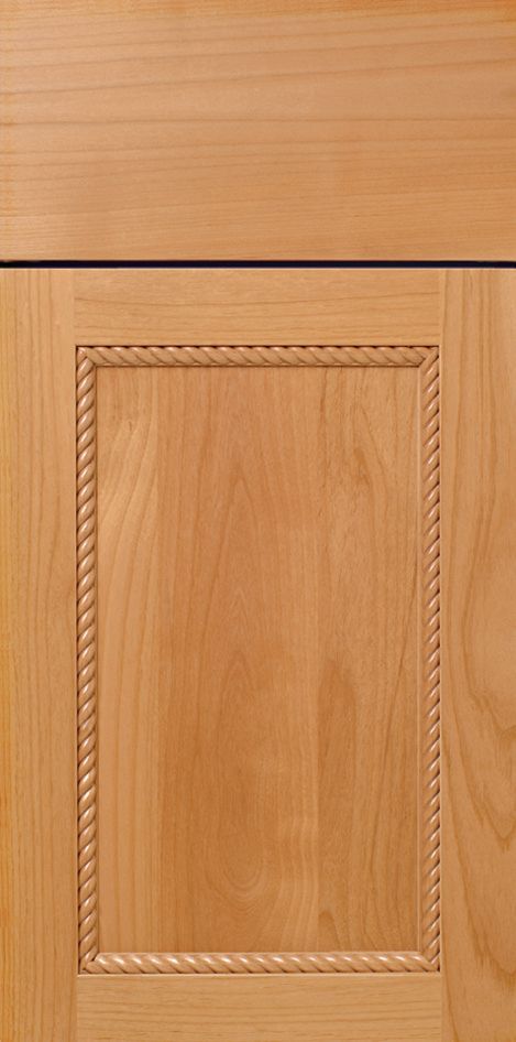 Wooden cabinet door with rope-like trim around a central panel.