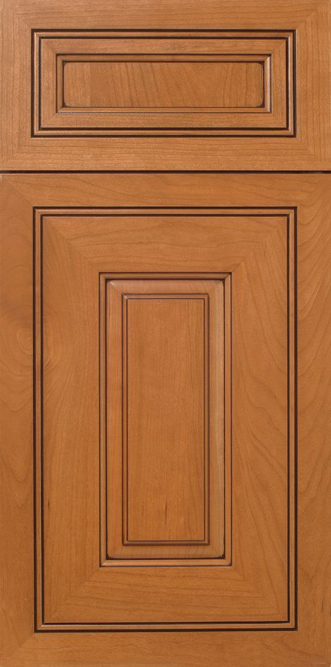 Wooden kitchen cabinet door with raised panel design and stained in a medium tone.