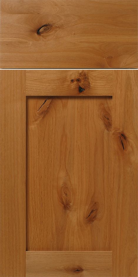 Close-up of a wooden cabinet door with a natural finish, showing wood grain details and knots.