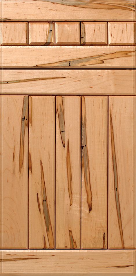 Wooden cabinet door with panel details and wood grain variation.