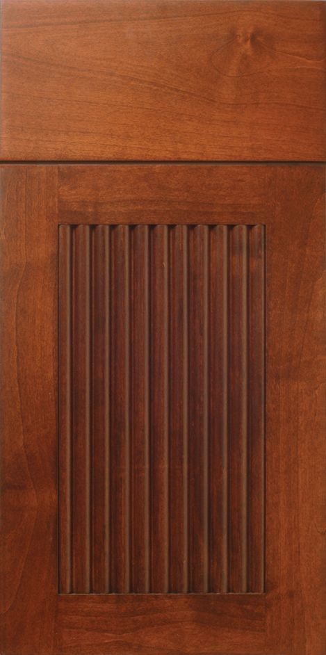 Brown cabinet door with vertical ribbed design panel.