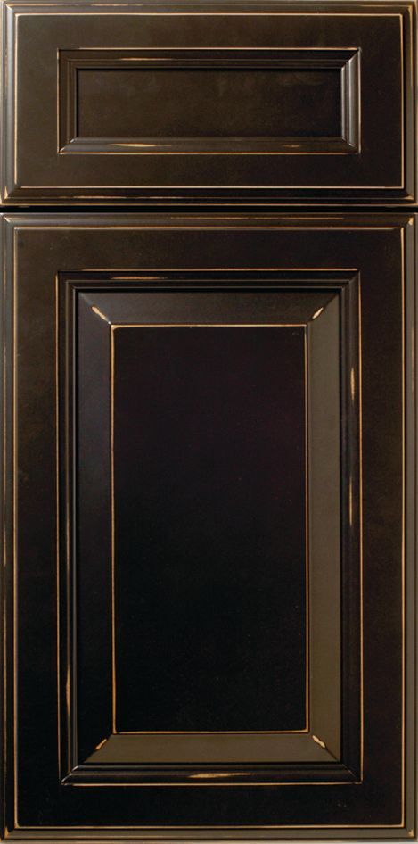 Dark brown kitchen cabinet with raised panel and bronze trim.