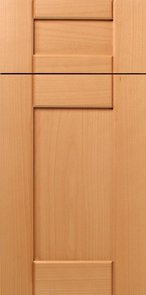 Light brown wooden cabinet door with recessed rectangular panels.