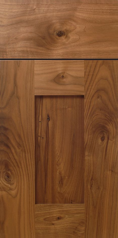 Wooden cabinet door with a recessed panel.