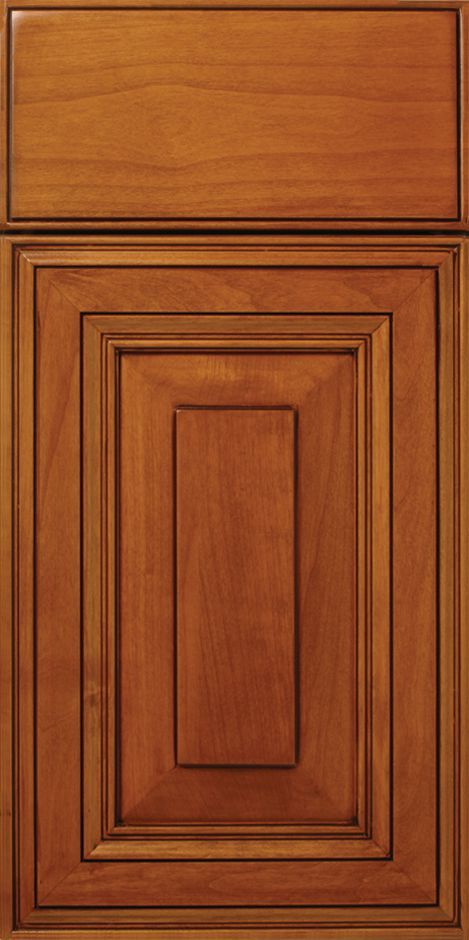Wooden kitchen cabinet door with a raised, layered panel design.