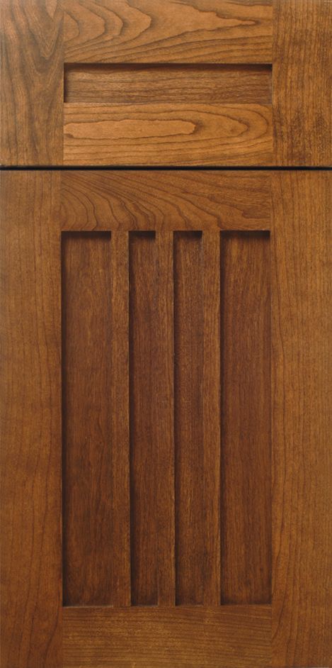 Wooden cabinet door with recessed panel and three vertical slats. Brown finish.