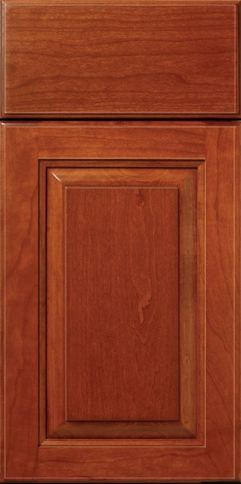 A cherry-stained wooden cabinet door.