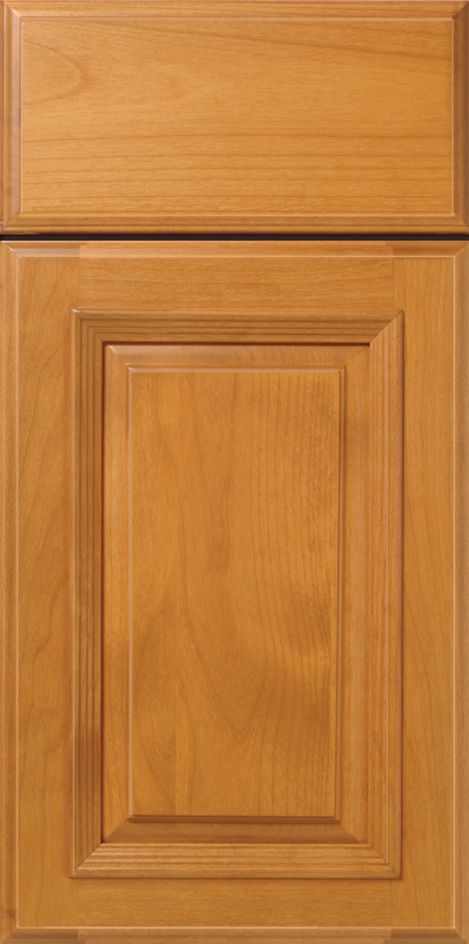 Wooden kitchen cabinet door with a raised panel and a golden finish.