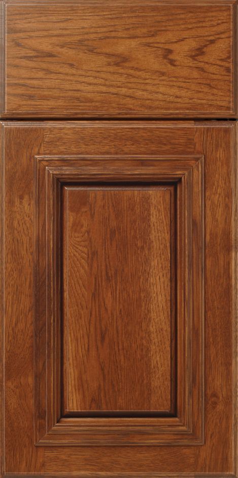Brown wooden cabinet door with a raised panel and wood grain.