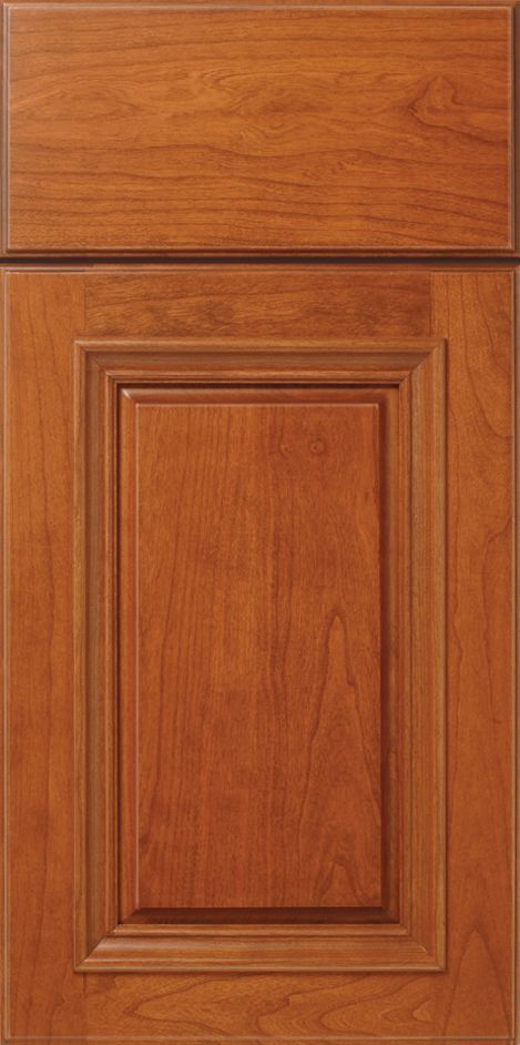 Wooden kitchen cabinet door with a raised panel, stained in a warm brown color.