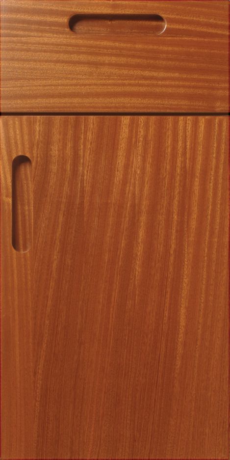 Wooden cabinet door with two carved-out handle areas; warm brown tones, vertical grain.