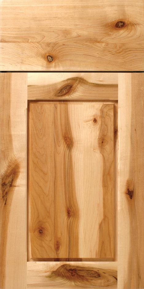 Wooden cabinet door, light brown color. Grain detail visible.