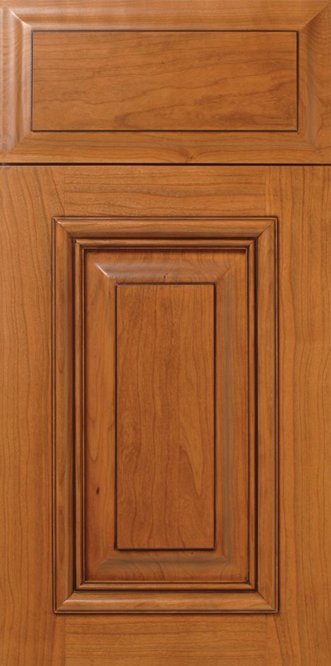Wooden cabinet door with raised panel and medium brown stain.